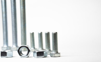Metal bolts on white background