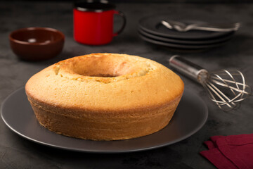 Homemade cake on a dark background.