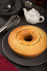 Homemade cake on a dark background.