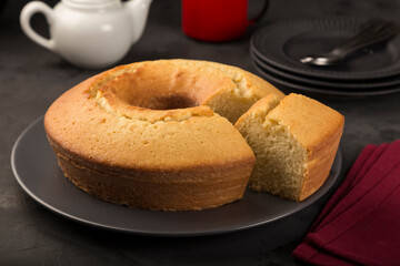 Homemade cake on a dark background.