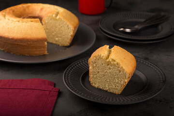 Homemade cake on a dark background.