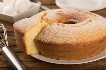 Homemade cake on a rustic wooden table.