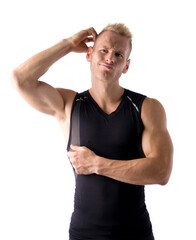Muscular young man unsure or confused, scratching head with hand, isolated on white background in...