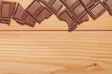 broken brown chocolate bar and background image texture top view