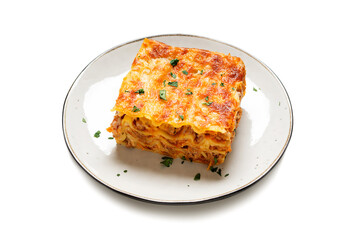 Portion of  ground beef lasagne topped with melted cheese and garnished with fresh parsley served on a gray plate . isolated on white background