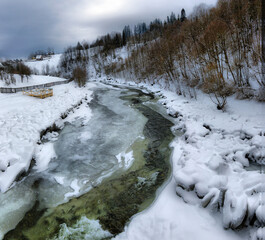 Moody view of frozen stones on the river on a frosty day. Location place Carpathian mountains, Ukraine, Europe.