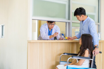 Obraz premium Paying by credit card..About treatment Inside the clinic hospital.