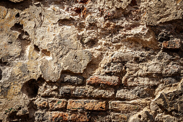 Old brick and plaster wall texture background