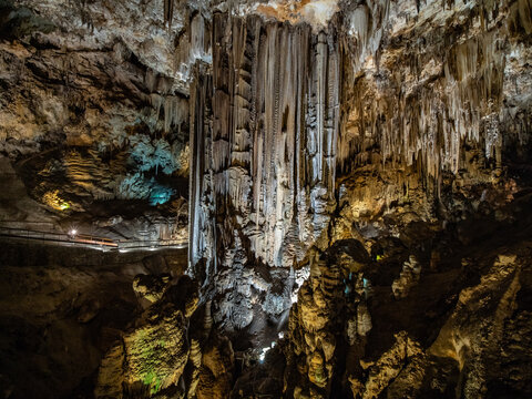 colorful iluminated interior of the stalactite caves, called cuevas de nerja, nerja caves near the city of Nerja, spain