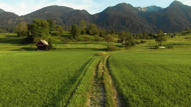 Aerial view. Mountains and buildings city, road, summer day sunset. Travel and tourism. green hills. Bohinjska Bistrica Slovenia, Triglav