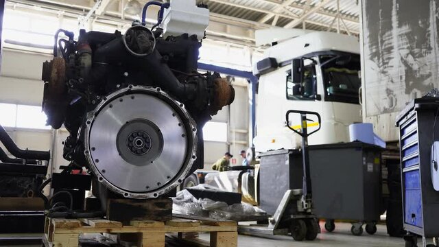 Disassembled engine at a truck repair service