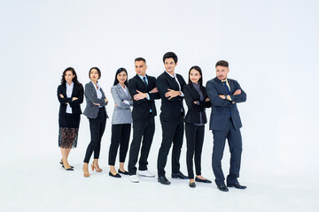 Obraz premium Full picture of a professional team standing with arms folded and looking at the camera..