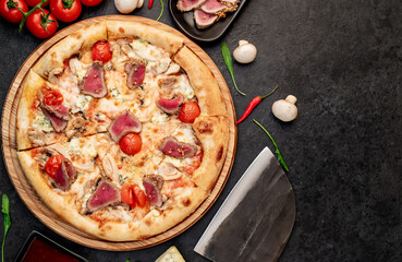delicious meat pizza on a stone background  with copy space for your text