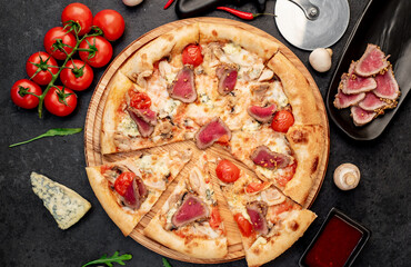 delicious meat pizza on a stone background