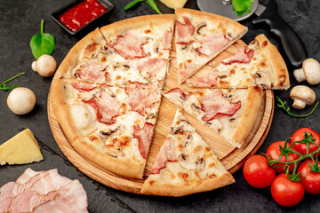 pizza with bacon, mushrooms and cheese on a stone background