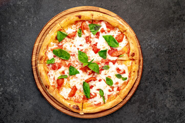 Pizza Margherita on a stone background 