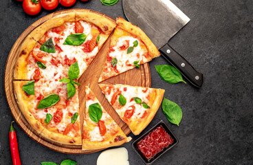 Pizza Margherita on a stone background with copy space for your text