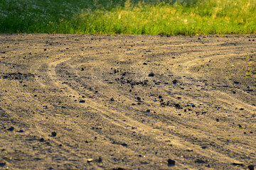 Gravel countryside road surface in warm sunset light