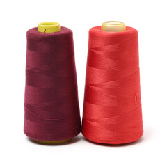 spools of thread for the textile industry on white background