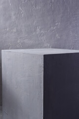 Grey cube near painted background texture as abstract. Architecture concept of minimalism design