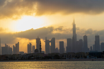 Dubai, UAE - 03.06.2021 Dubai public beach with city skyline on background.Sunrise hour. Outdoor