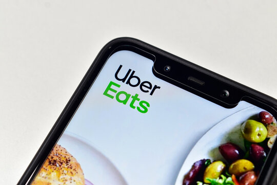 Uber eats app on smartphone isolated on white background 