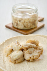 Closeup view of canned mackerel on a plate.