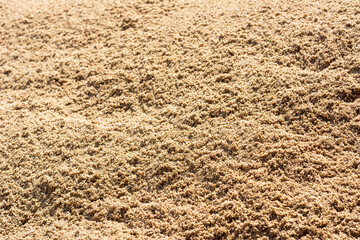 Closeup dry sand pile for construction.