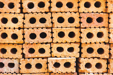 Closeup red brick stack for construction.