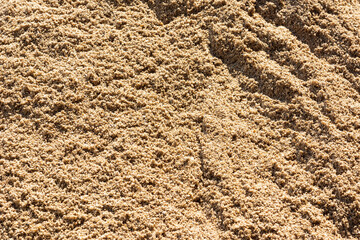 Closeup dry sand pile for construction.