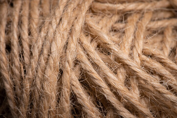 Close-up view of natural twine wound on a card. Craft background