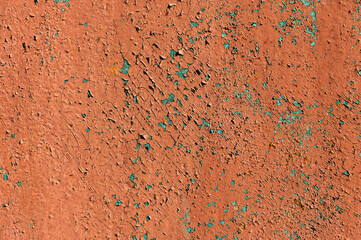 Old flaky paint on a metal surface. Red green grunge texture