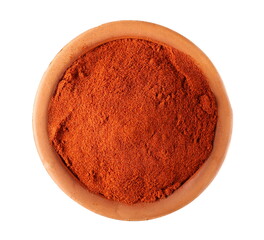 Pile of red paprika powder in clay pot isolated on white background, top view