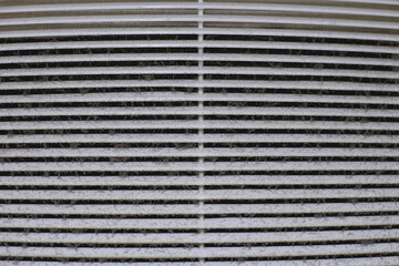 Dirty air ventilation grill of HVAC with clogged filter.