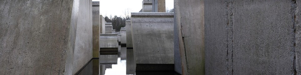 Concrete lab test set-up in an artificial lake in the 'Waterloopbos' in the Netherlands. It was used in the 1960s for the development of the Delta Works