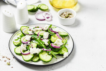 Rucola cucumber salad sesame seeds. Space for text.