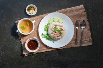 Sliced Hainan-style chicken with marinated rice and soup (Khao Mun Kai)or steamed chicken rice - Asian food style