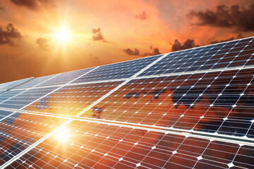 Photo collage of sunset and solar panel, photovoltaic, alternative electricity source - concept of...