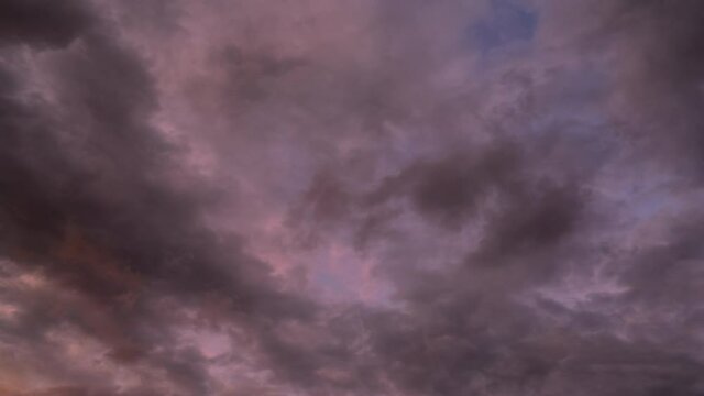 Fast-flying light clouds changing their character from 
dark thunderstorms, to light sunlit
evening, sunset clouds.

