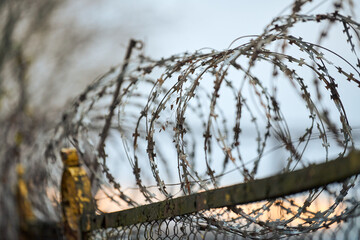 Barbed wire on fence of restricted area