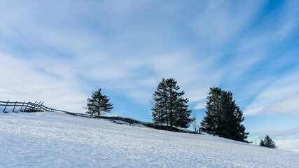 Snow covered fields with a fence, Toten, Norway.