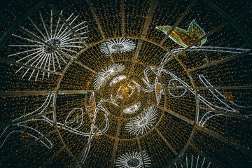 Shot of a light up christmas tree from inside looking up