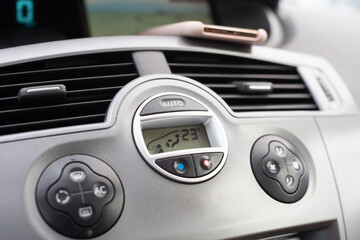 Dashboard in a passenger car. Heating and air conditioning control buttons.