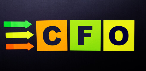Bright multi-colored paper stickers on a black background with the text CFO Chief Financial Officer