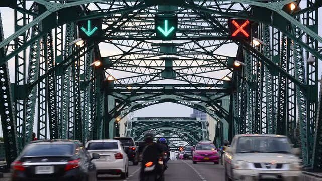  People drive out to play at Phra Phuttha Yodfa Bridge, Memorial Bridge BANGKOK THAILAND.