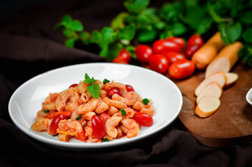 Pasta with spicy tomato sauce and basil and sausage.