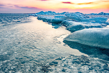 Ice layering with water development.