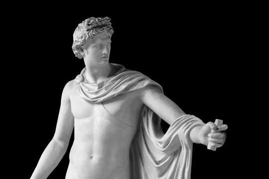 Copy of very ancient statue of David isolated on black background.