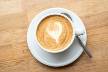 cup of coffee on wooden table