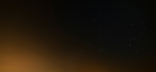 Fototapeta na wymiar Beautiful winter dark starry sky. Night photography, astronomical background.